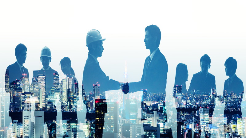 握手しているシルエット